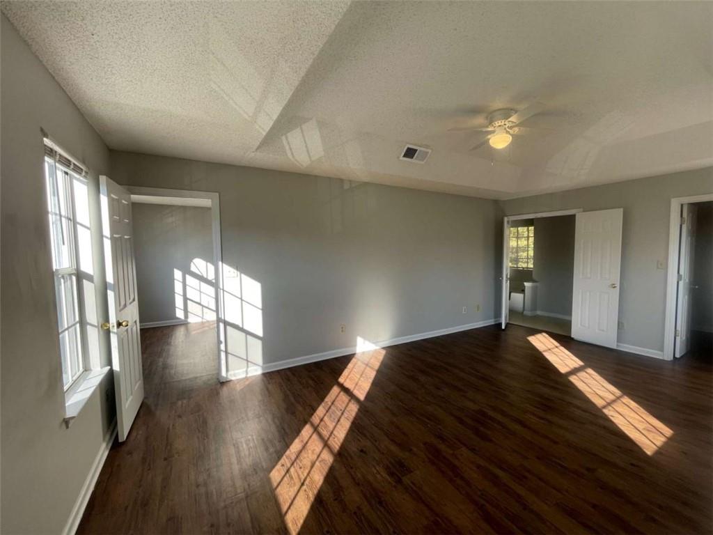 6387 Seths Way Lithonia, GA 30058 - Photo 24 of 44 a view of an empty room with wooden floor and a window