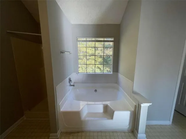 a view of wooden floor in a bathroom