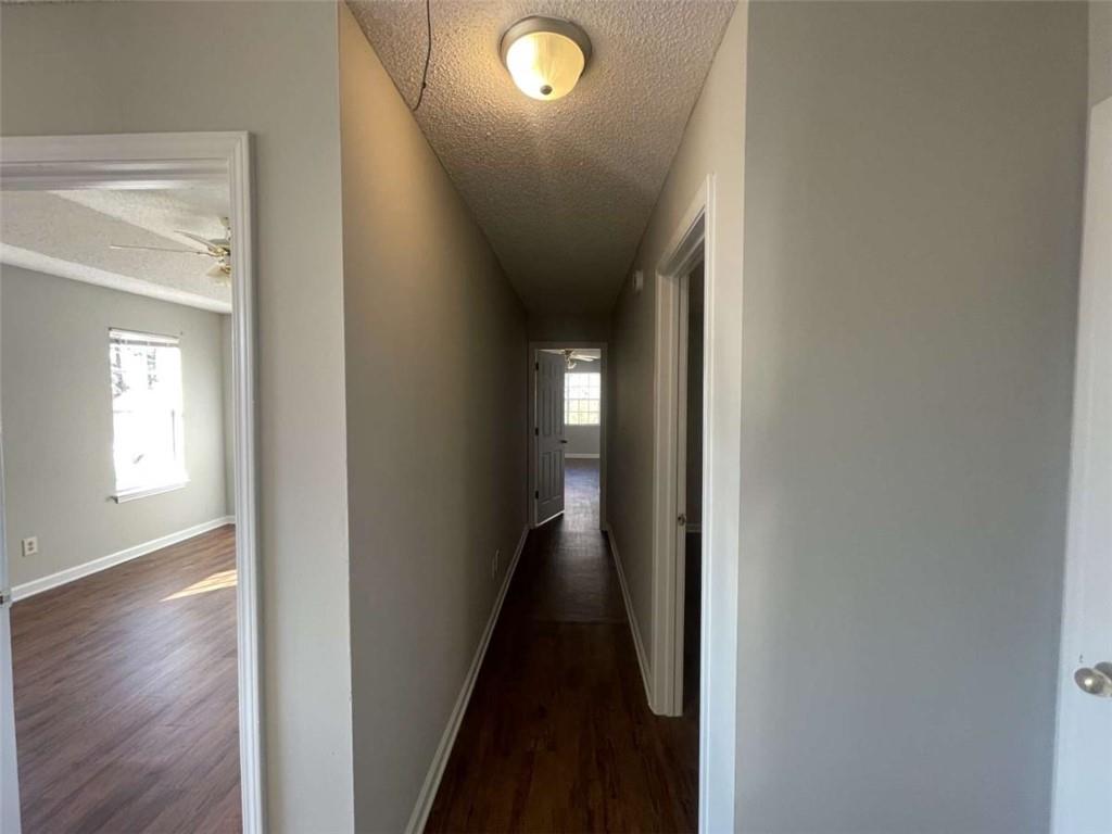 6387 Seths Way Lithonia, GA 30058 - Photo 33 of 44 a view of a hallway with wooden floor and a window