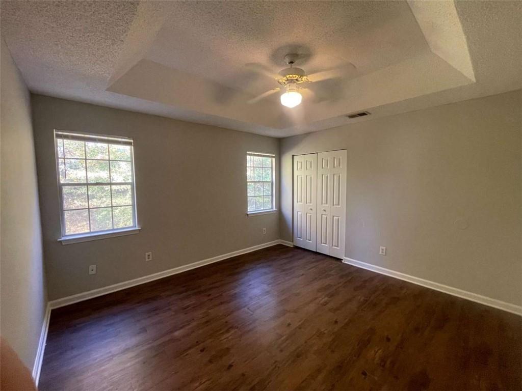 6387 Seths Way Lithonia, GA 30058 - Photo 34 of 44 a view of an empty room with a window and wooden floor