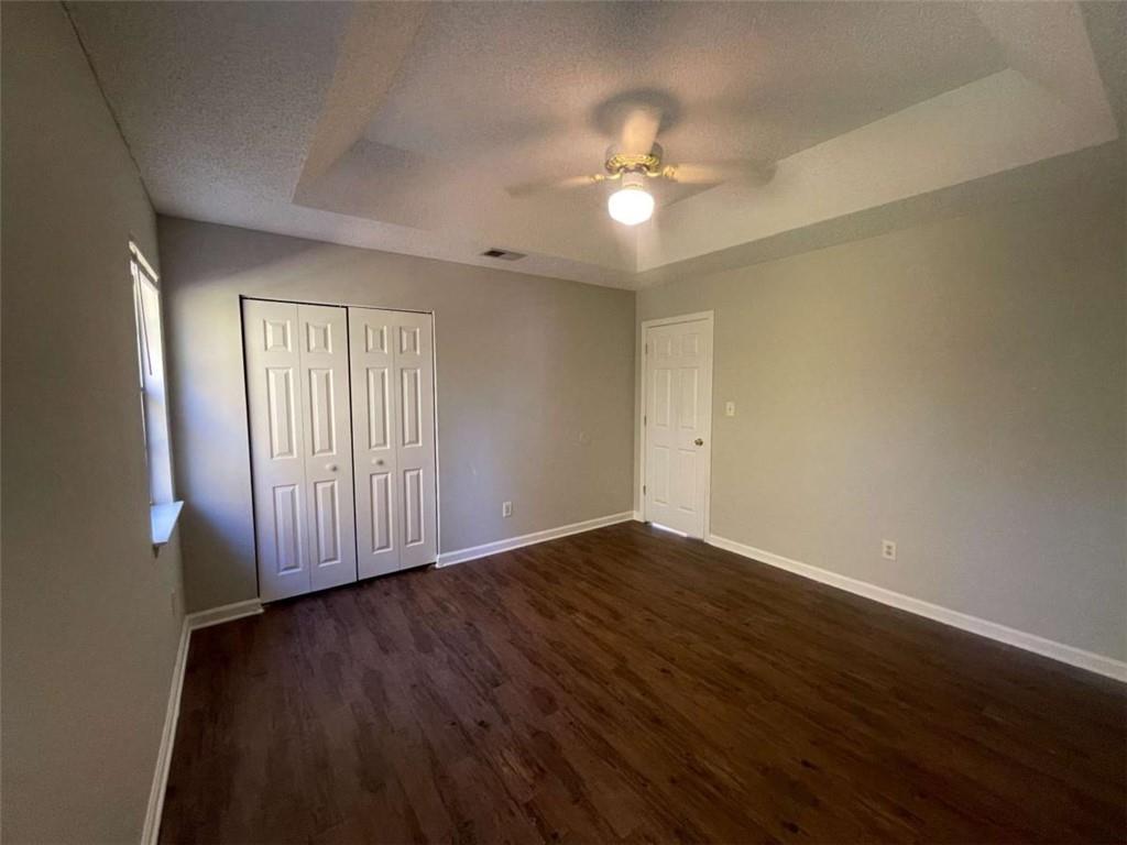 6387 Seths Way Lithonia, GA 30058 - Photo 35 of 44 a view of an empty room with wooden floor and a window