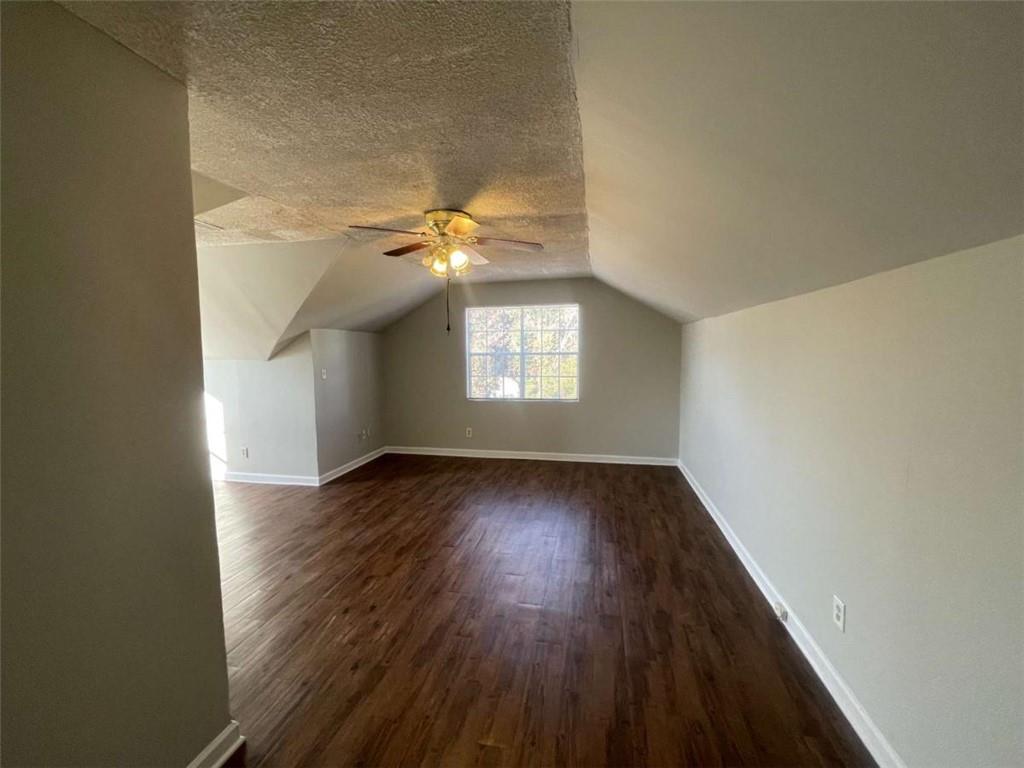 6387 Seths Way Lithonia, GA 30058 - Photo 37 of 44 an empty room with wooden floor and windows