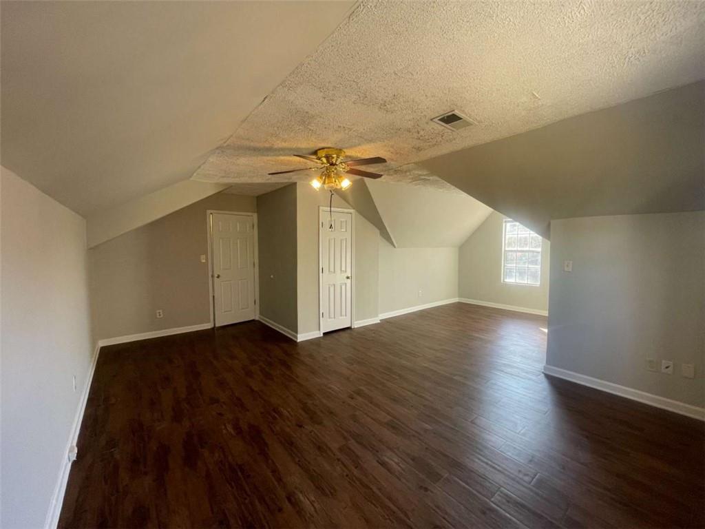 6387 Seths Way Lithonia, GA 30058 - Photo 39 of 44 a view of an empty room with wooden floor and a window