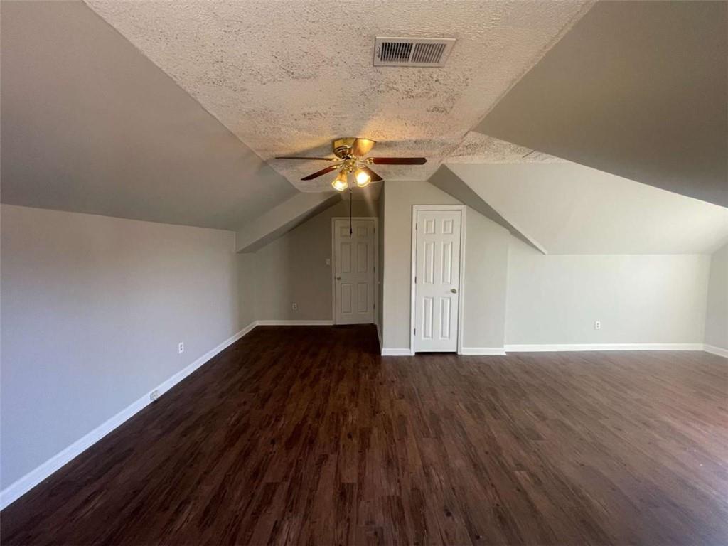 6387 Seths Way Lithonia, GA 30058 - Photo 40 of 44 a view of an empty room with wooden floor