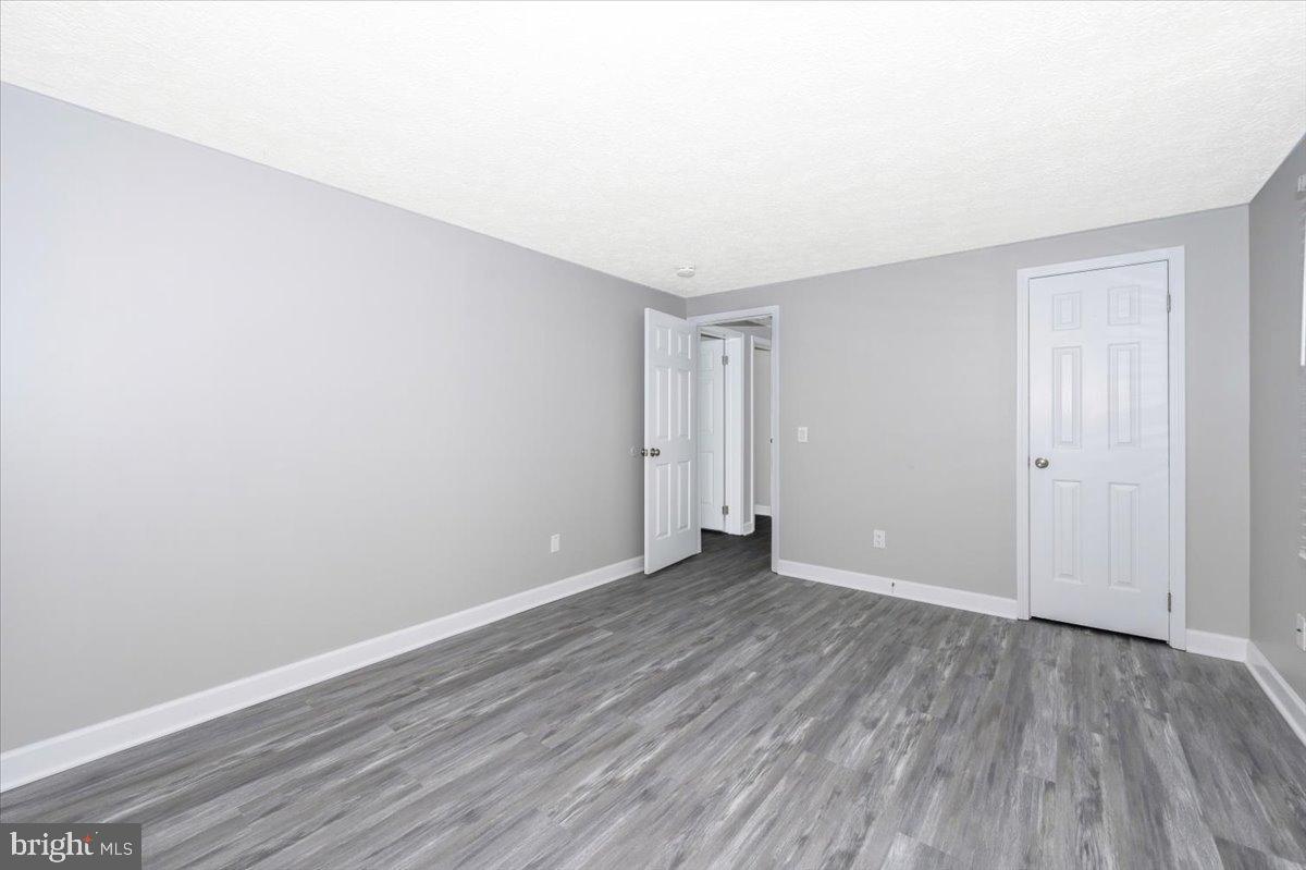 12284 Bandera Lane Lusby, MD 20657 - Photo 25 of 55 a view of an empty room with wooden floor