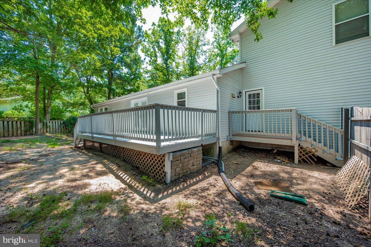 12284 Bandera Lane Lusby, MD 20657 - Photo 40 of 55 a view of backyard with a small deck and a garden