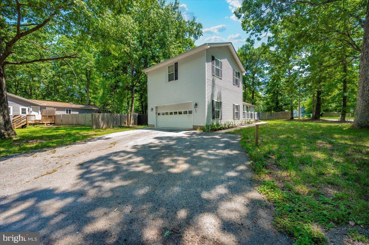 12284 Bandera Lane Lusby, MD 20657 - Photo 47 of 55 Charming home nestled among lush greenery.