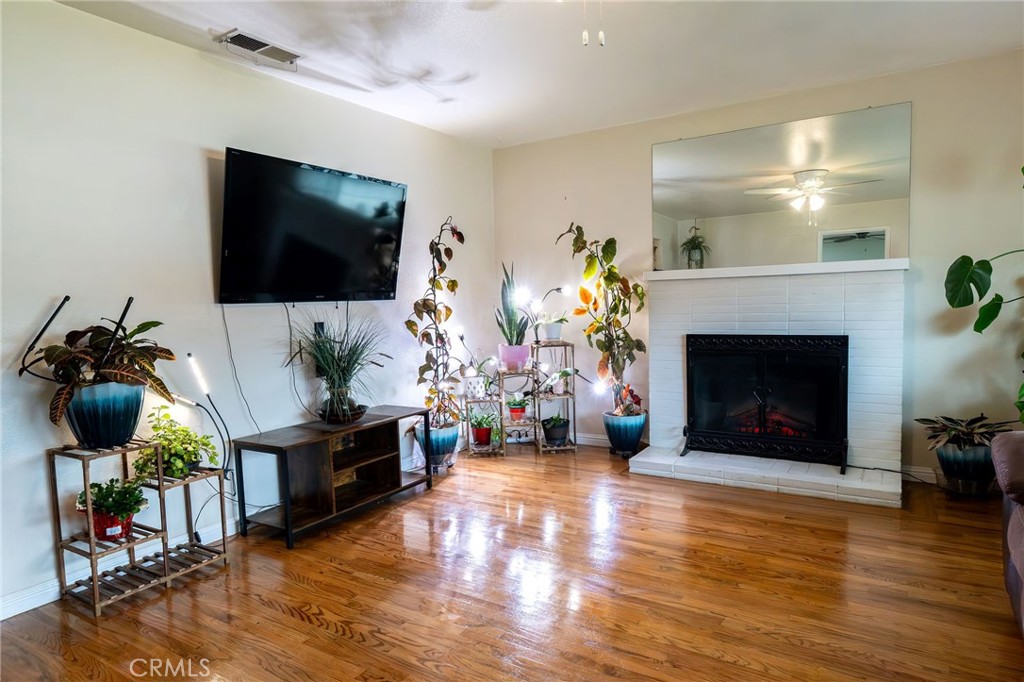 1050 West Cedar Street Willows, CA 95988 - Photo 4 of 39 Living room with cozy fireplace has electric insert