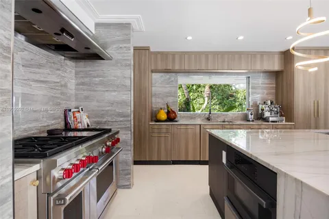 a kitchen with a stove and a sink