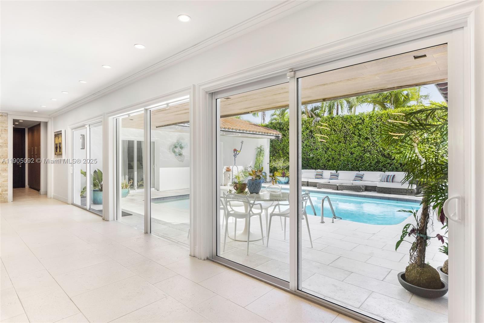 1233 102nd Street Bay Harbor Islands, FL 33154 - Photo 19 of 52 a room with a large window and pool table