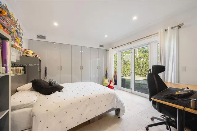 a bedroom with a bed and a desk