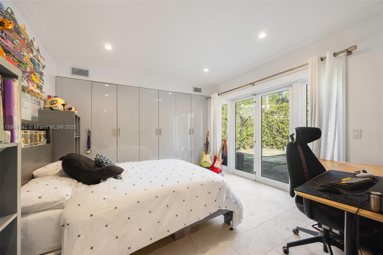 1233 102nd Street Bay Harbor Islands, FL 33154 - Photo 27 of 52 a bedroom with a bed and a desk