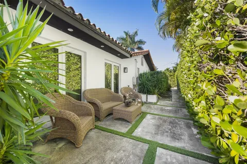 a swimming pool with outdoor seating and yard