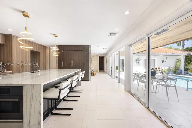 a large white kitchen with lots of counter top space