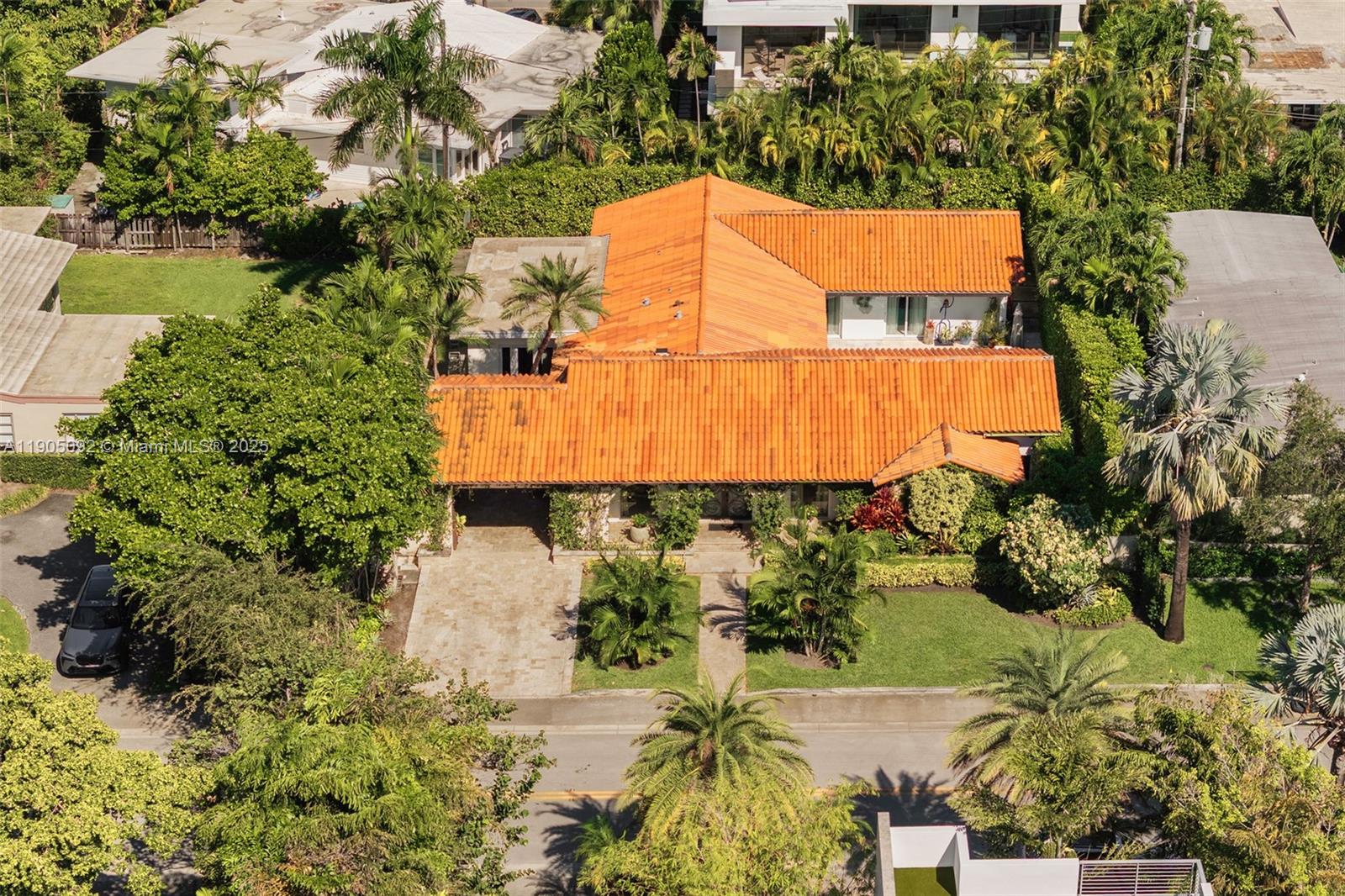 1233 102nd Street Bay Harbor Islands, FL 33154 - Photo 45 of 52 an aerial view of a house with a yard and a lake view