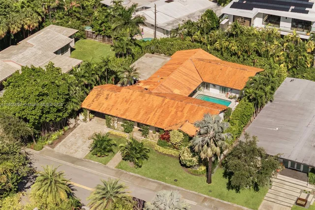 an aerial view of a house with a lake view