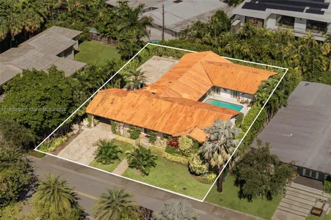 an aerial view of a house with a lake view