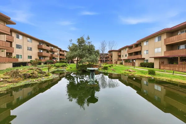 a swimming pool view with a outdoor seating
