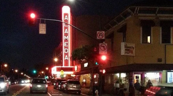 a view of a building with car parked