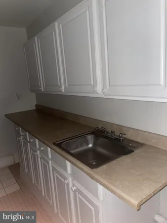 a close view of sink and cabinets