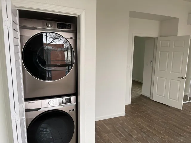 a close view of a utility room with washer and dryer