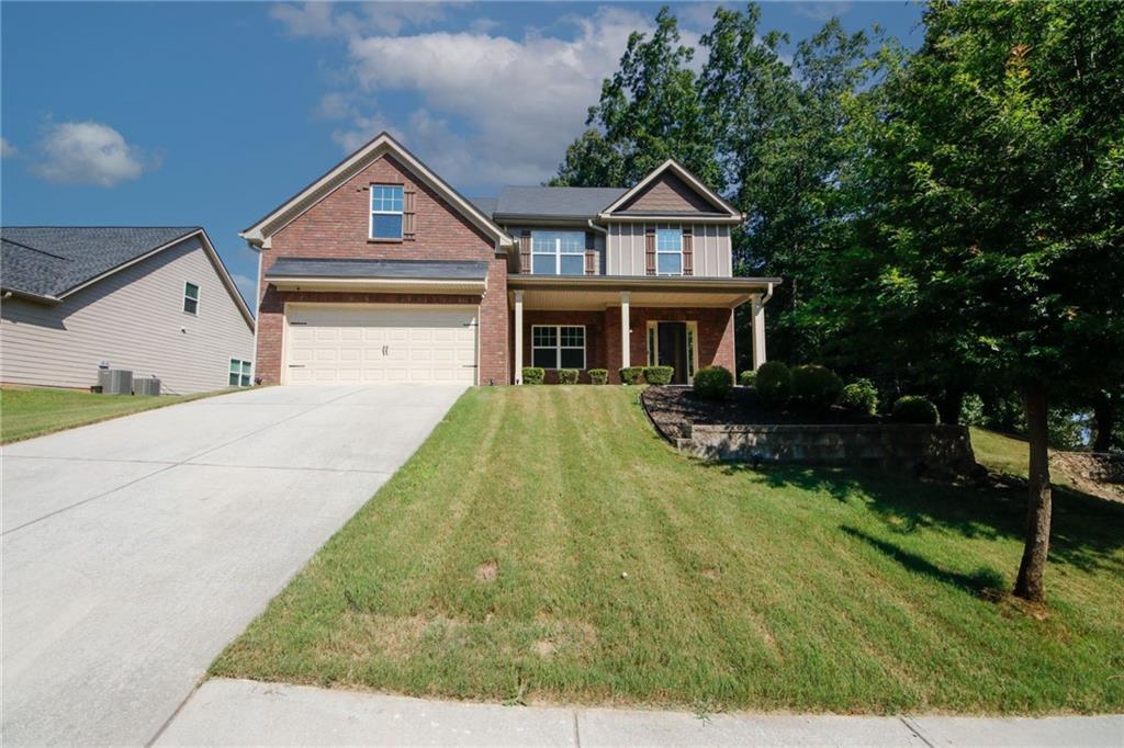 5637 Valley Loop Fairburn, GA 30213 - Photo 1 of 1 a front view of a house with a yard