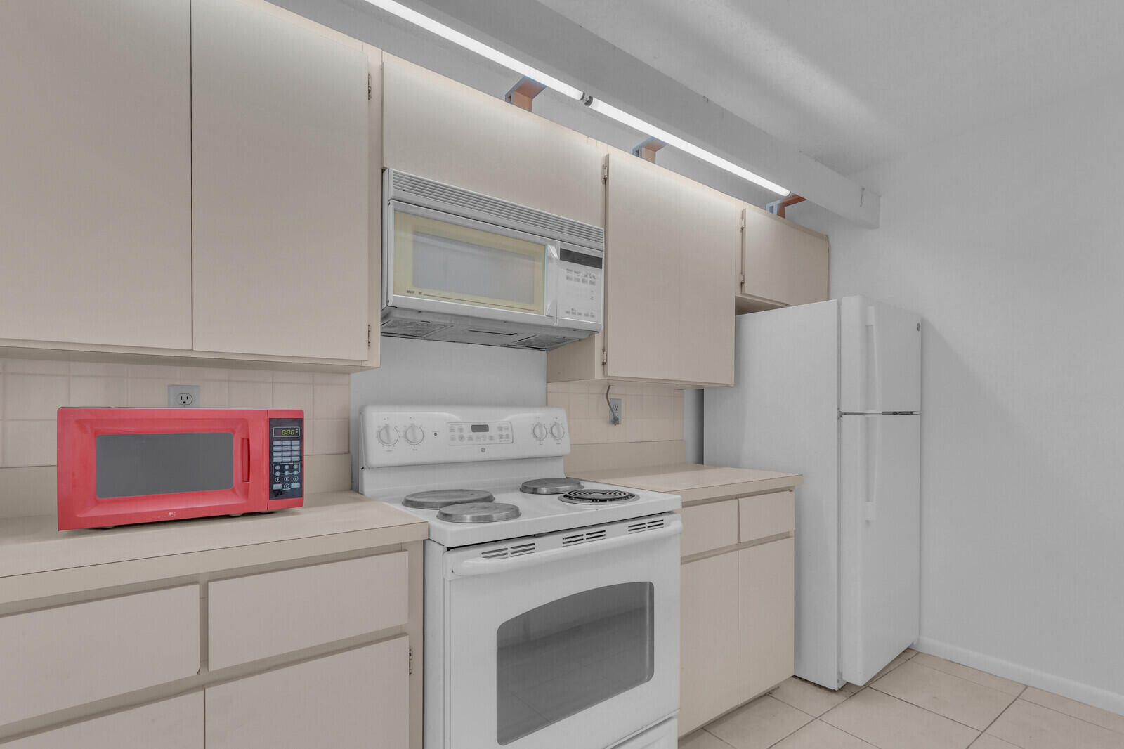 3061 30th Court Jupiter, FL 33477 - Photo 12 of 40 a kitchen with stainless steel appliances granite countertop a stove and a refrigerator