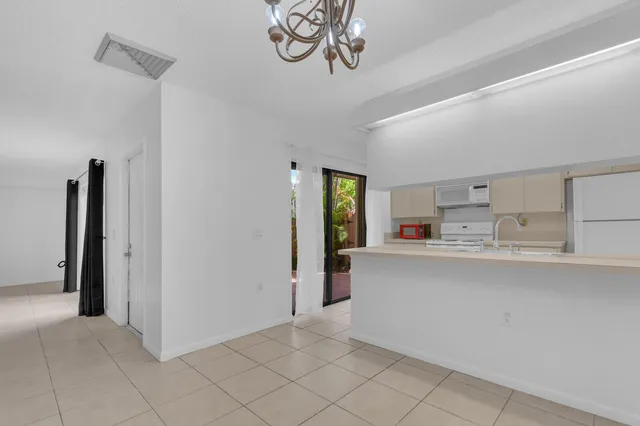 a kitchen with a sink cabinets and appliances