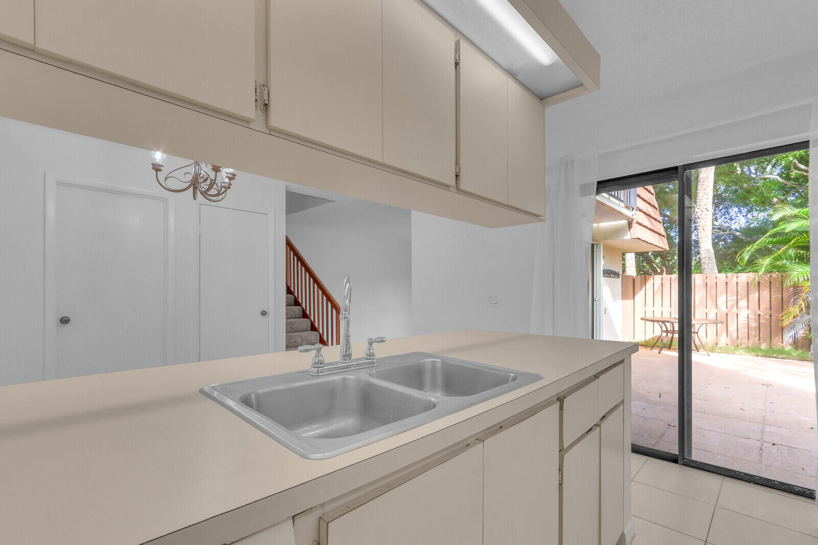 3061 30th Court Jupiter, FL 33477 - Photo 16 of 40 a kitchen with a sink and large window
