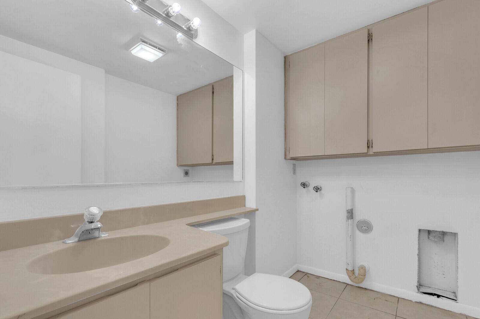 3061 30th Court Jupiter, FL 33477 - Photo 18 of 40 a bathroom with a sink a toilet and vanity