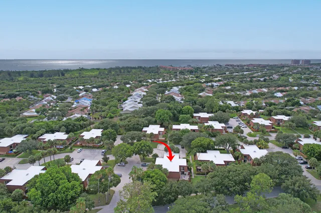 an aerial view of city and green space