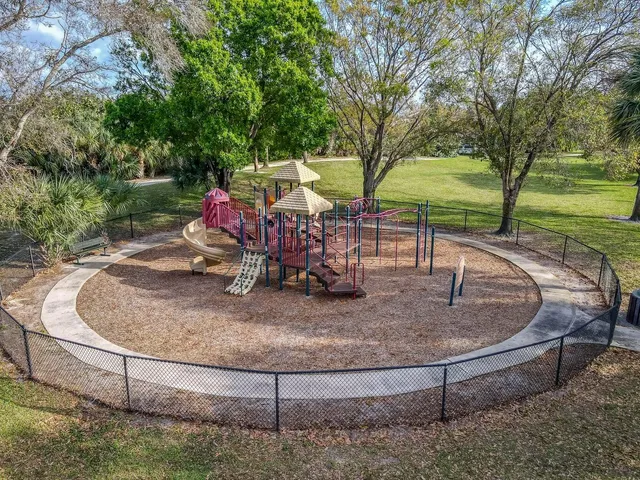 a view of a playground with basketball court