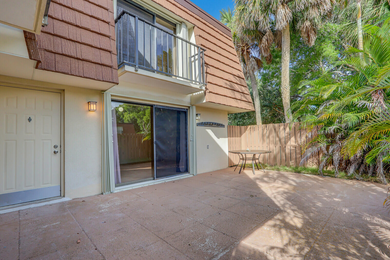3061 30th Court Jupiter, FL 33477 - Photo 5 of 40 a view of the house with backyard and sitting area