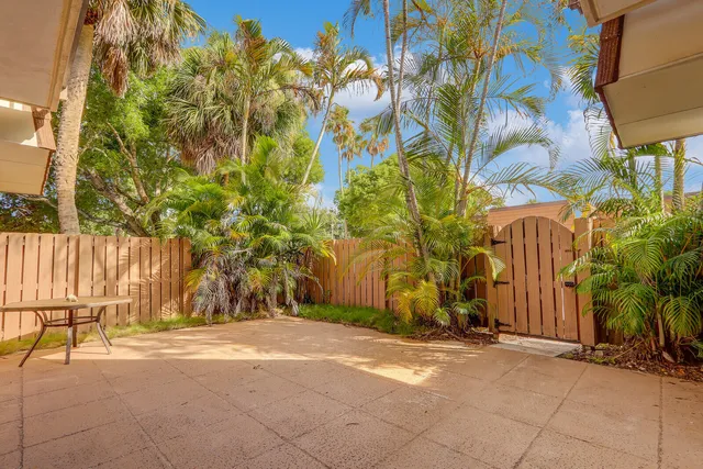 a view of a backyard of the house