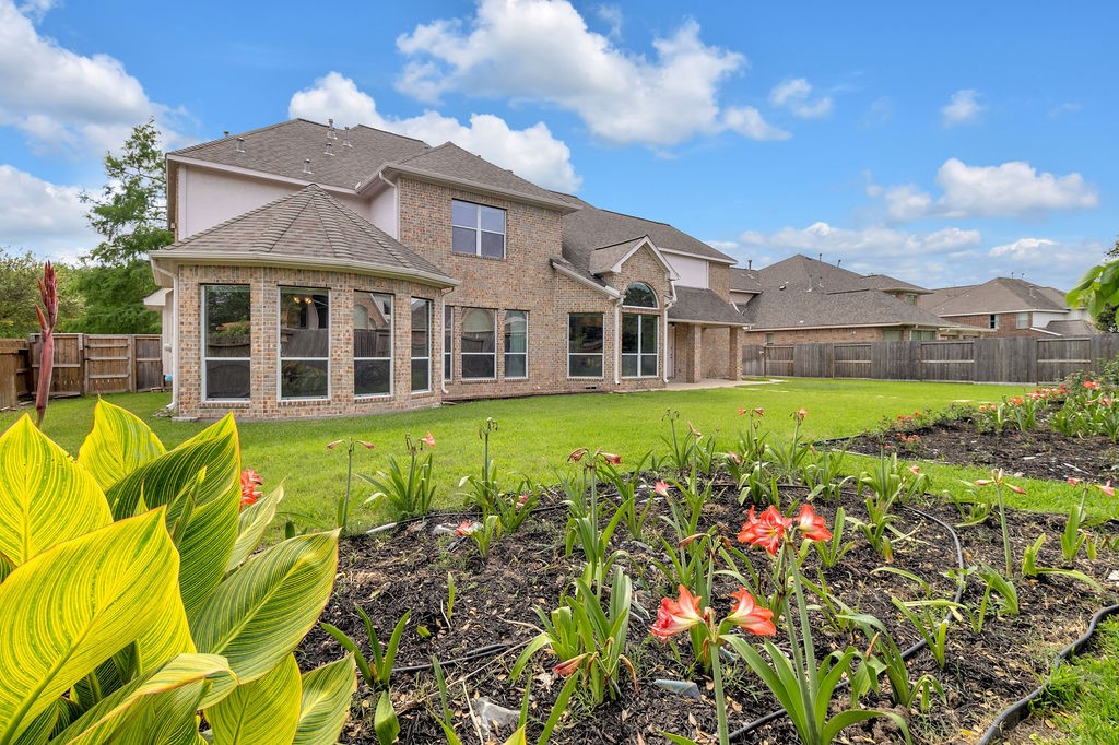 7306 Starflower Katy, TX 77494 - Photo 49 of 50 a view of a house with a big yard and potted plants