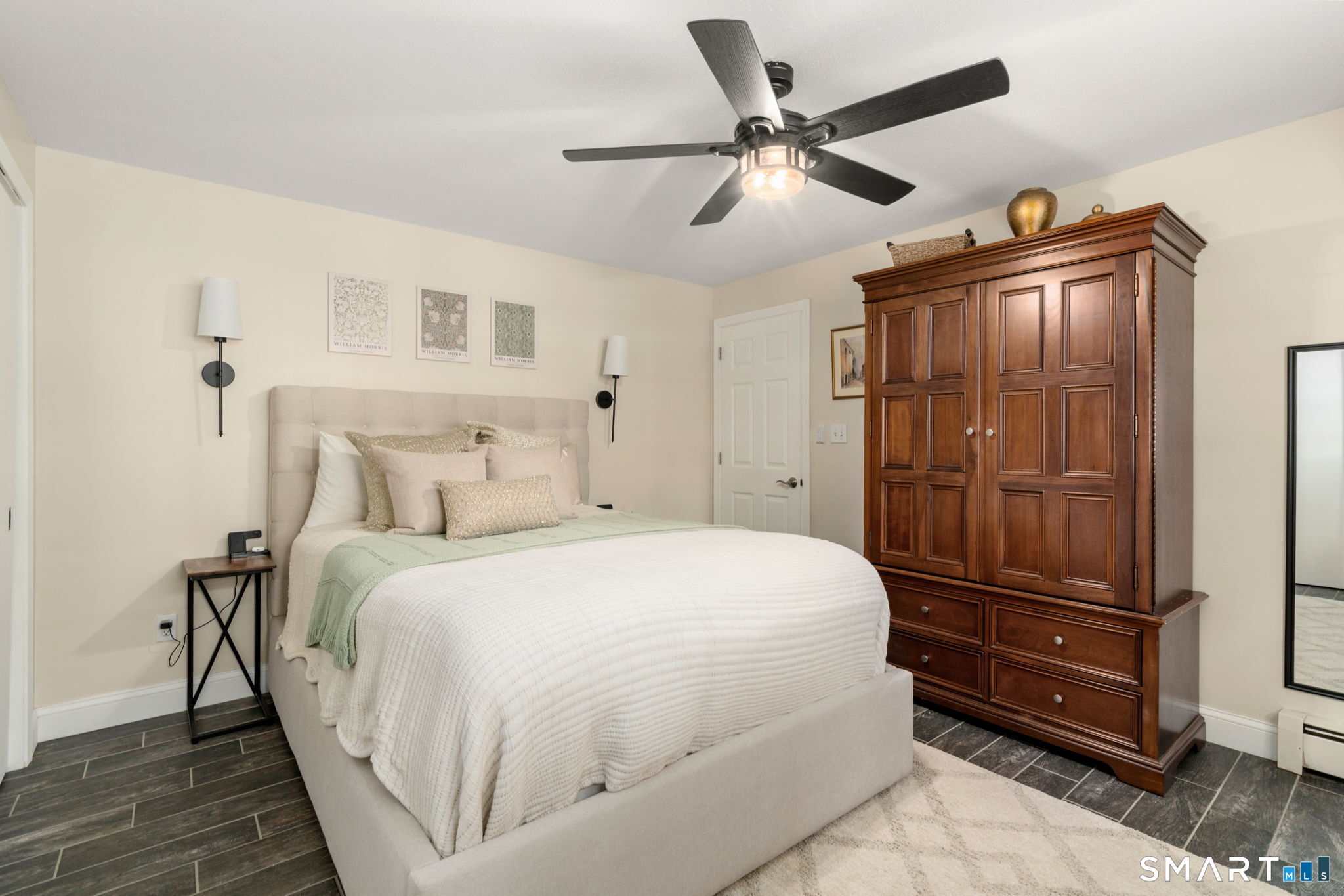 31 Cowan Street Suffield, CT 06078 - Photo 17 of 29 a bedroom with a bed and a ceiling fan