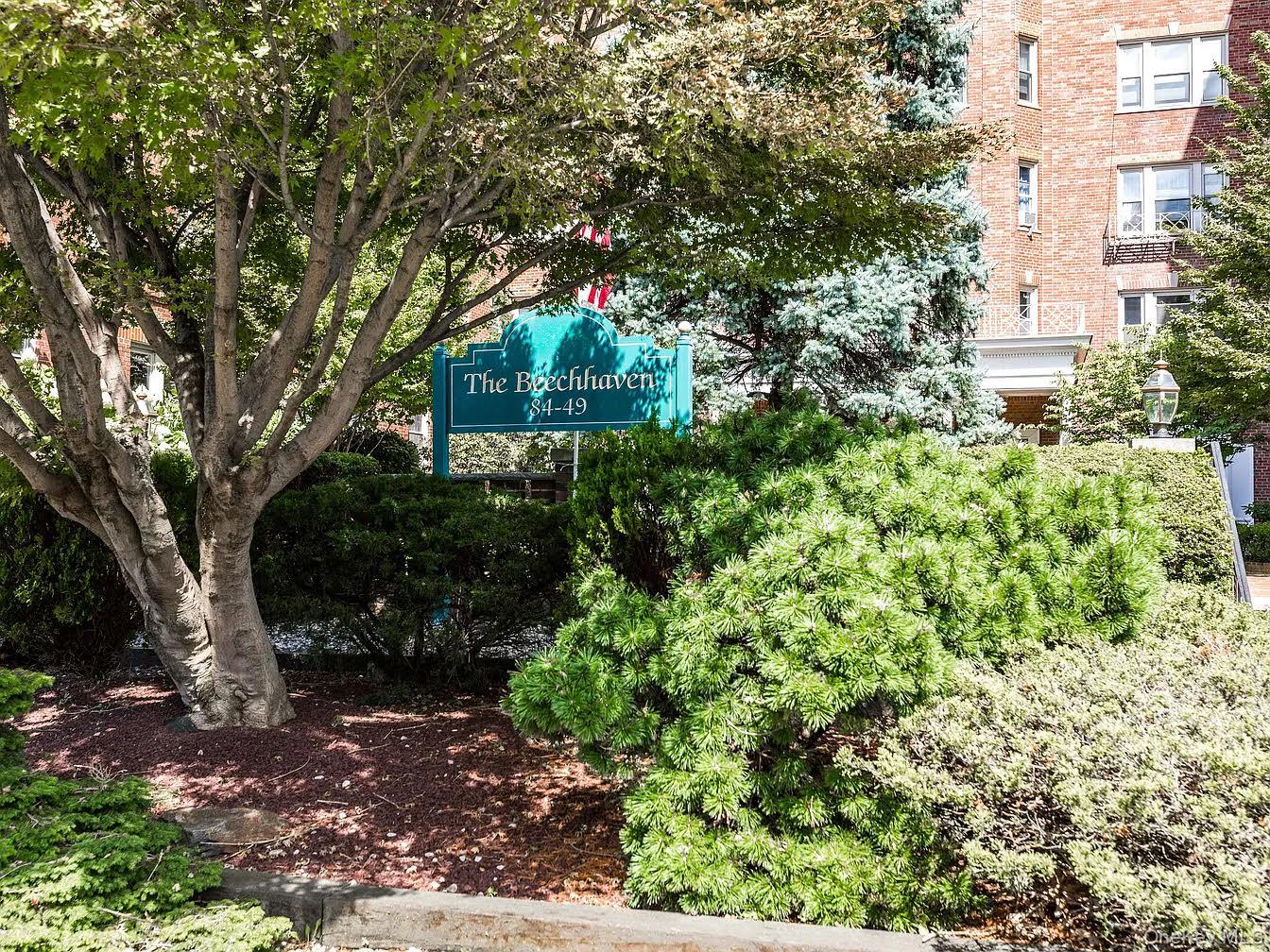 84-49 168th Street, Unit 2B Queens, NY 11432 - Photo 2 of 12 a view of a large building with a tree