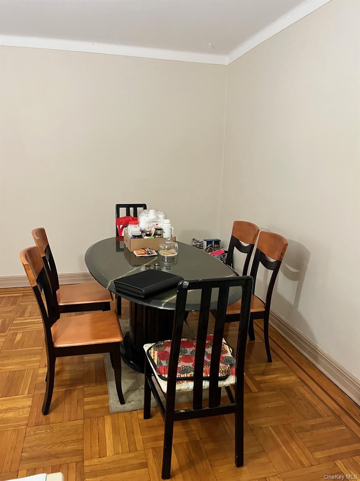 84-49 168th Street, Unit 2B Queens, NY 11432 - Photo 10 of 12 a view of a dining room with furniture and wooden floor