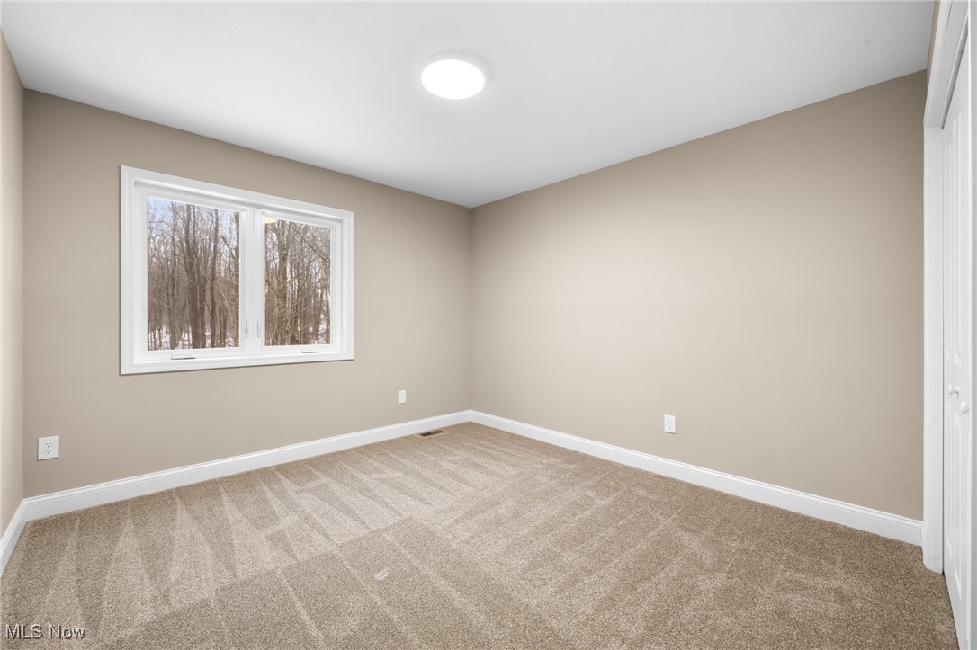 39600 Aurora Road Solon, OH 44139 - Photo 34 of 49 Unfurnished room featuring baseboards and light colored carpet