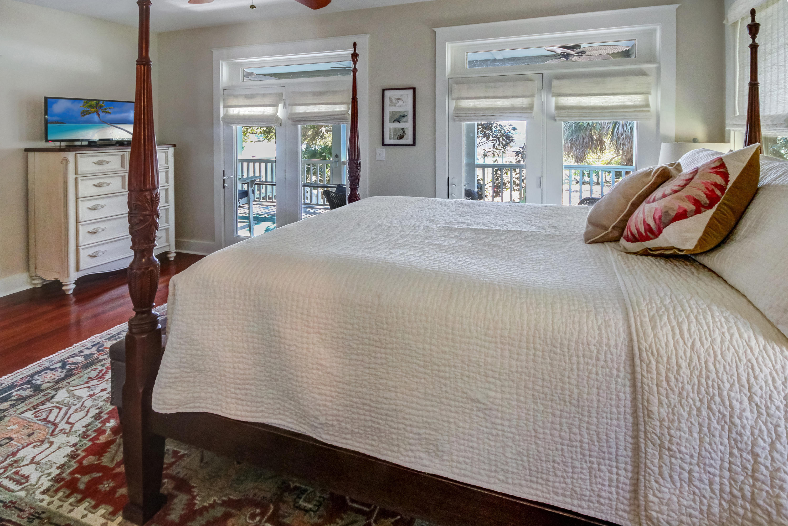 8511 Oyster Factory Road Edisto Island, SC 29438 - Photo 13 of 34 Master bedroom w/ 2 sets of french doors