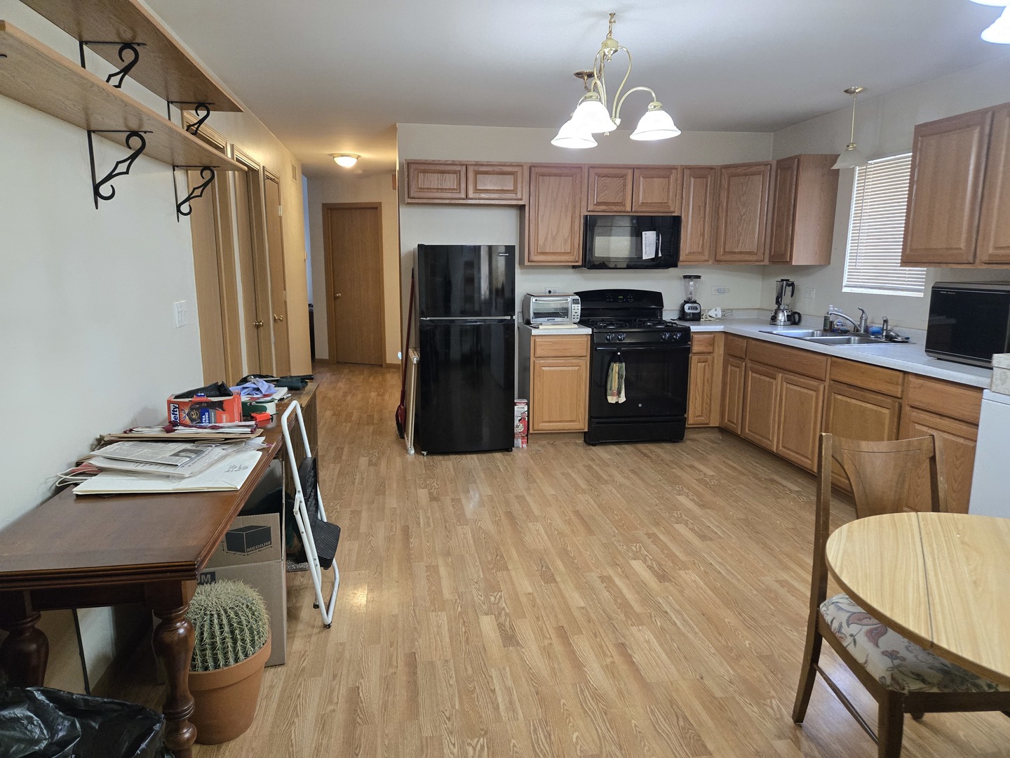 3117 Carpenter Street Steger, IL 60475 - Photo 7 of 20 a kitchen with granite countertop a refrigerator stove and microwave