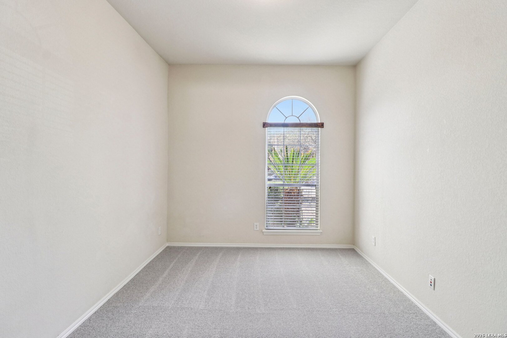 10723 Kobort Helotes, TX 78023 - Photo 16 of 36 an empty room with a window