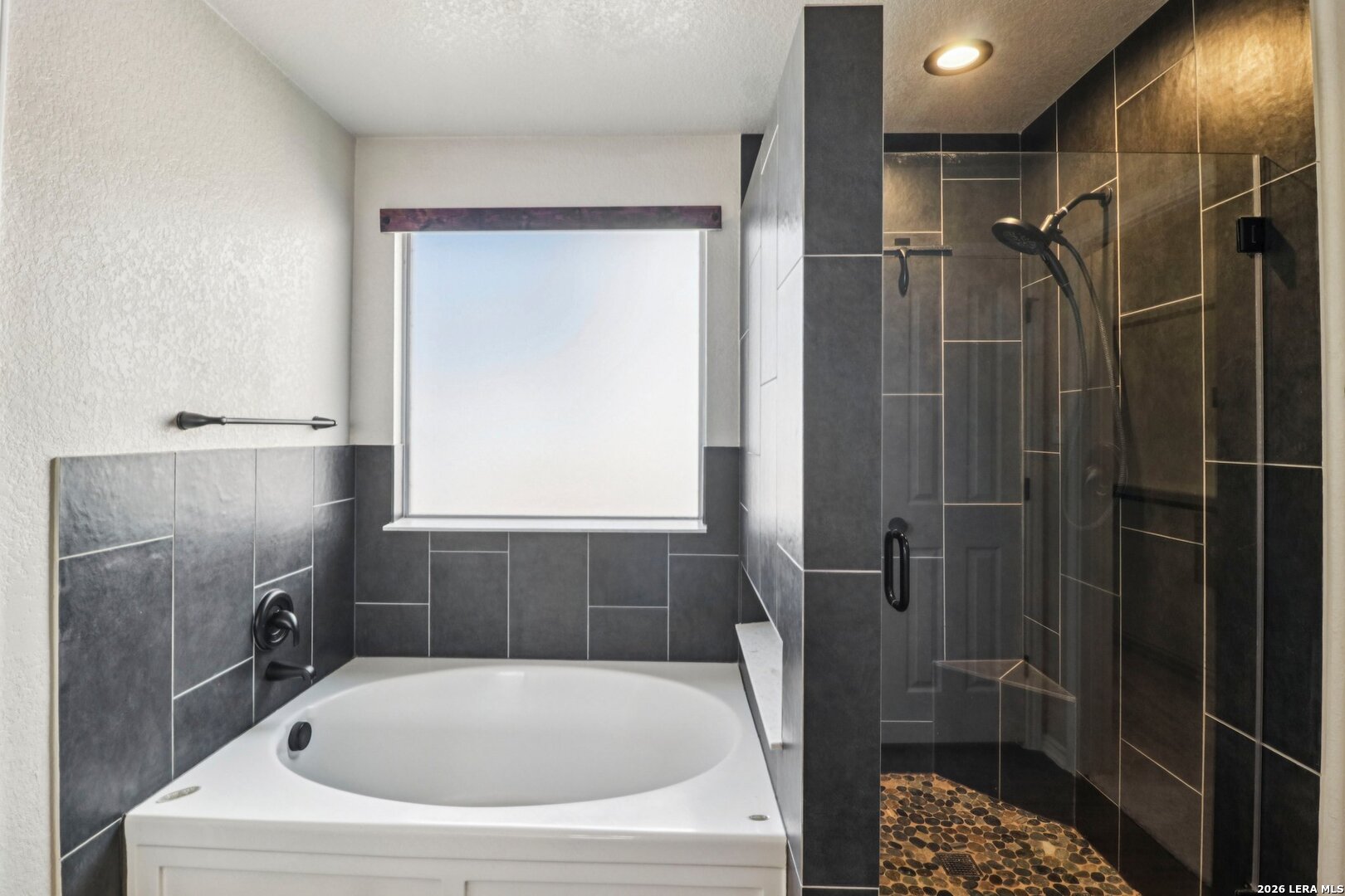 10723 Kobort Helotes, TX 78023 - Photo 25 of 36 a bathroom with a tub