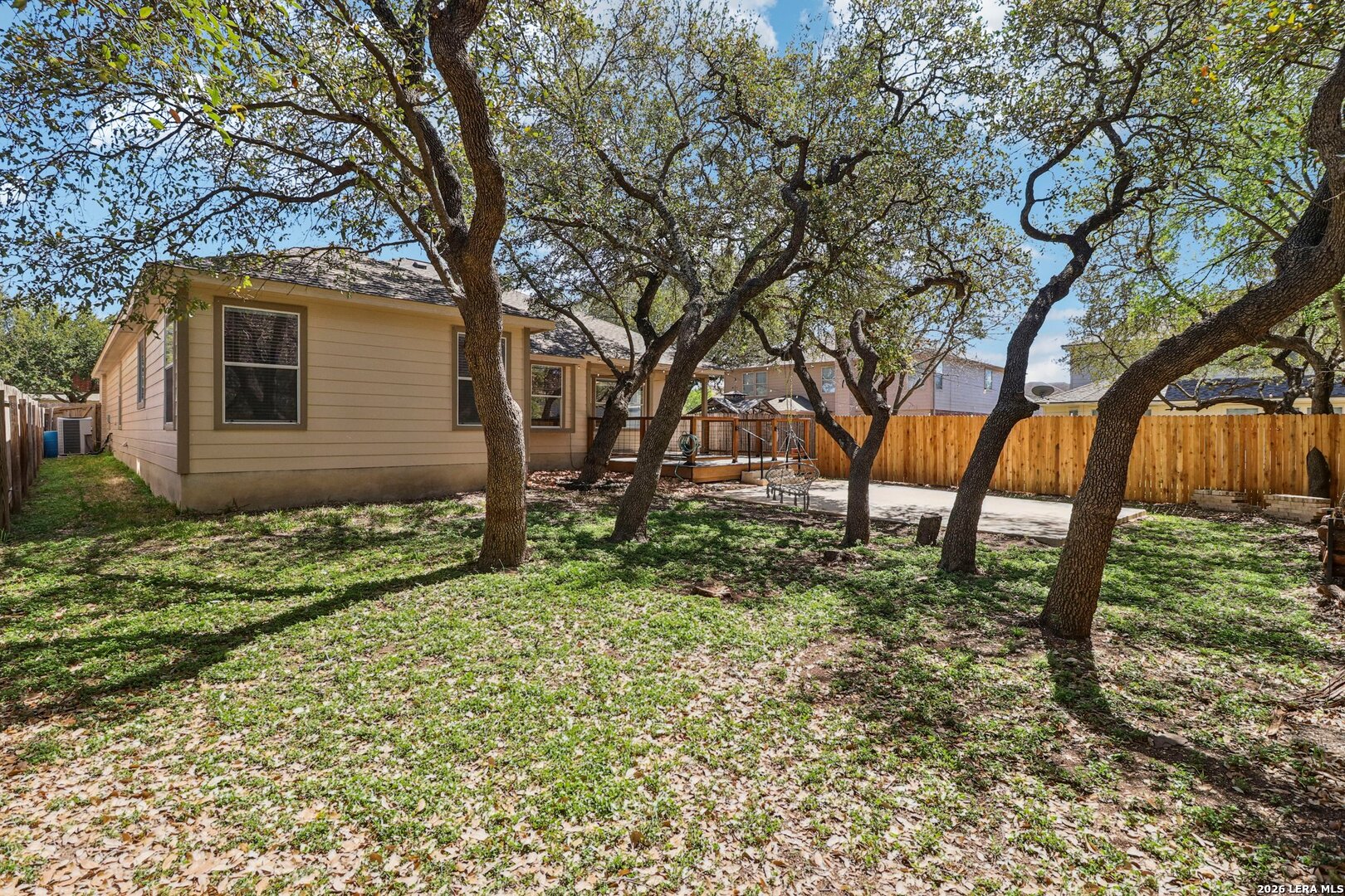 10723 Kobort Helotes, TX 78023 - Photo 34 of 36 a backyard of a house with lots of green space