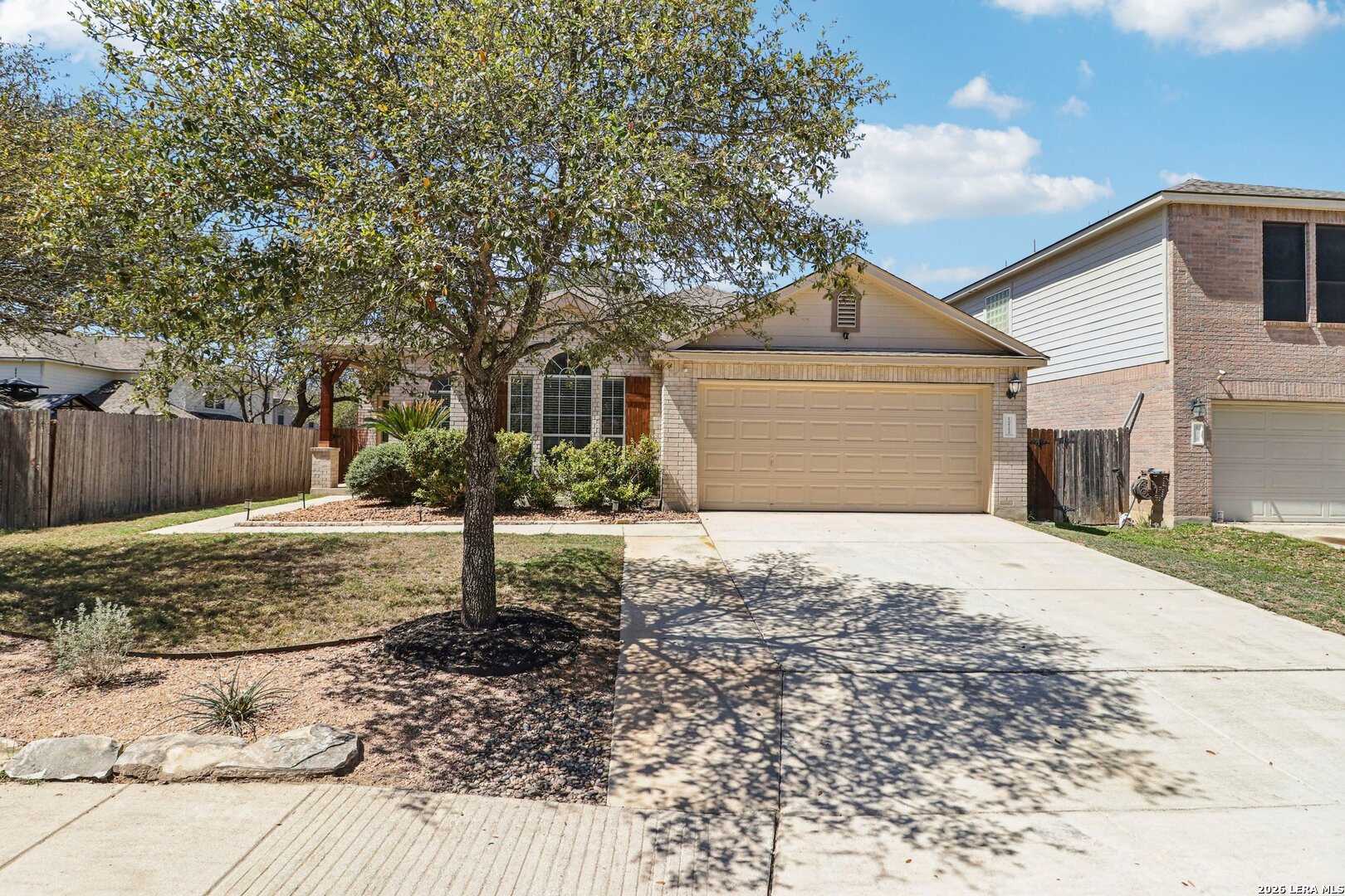 10723 Kobort Helotes, TX 78023 - Photo 6 of 36 a front view of a house with a yard and garage
