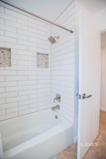 737 Peg Street Ridgecrest, CA 93555 - Photo 36 of 43 a bathroom with a shower and a bath tub