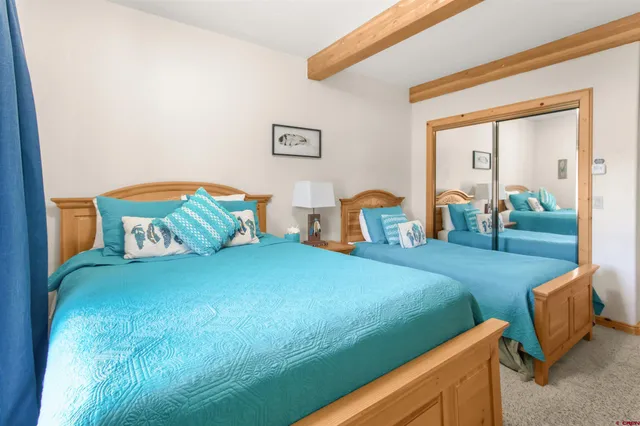 a bedroom with a bed and a table