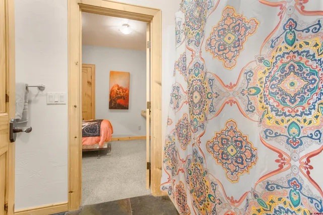 a en suite bathroom with a sink and a large mirror