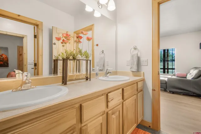 a view of a big room with wooden floor and furniture