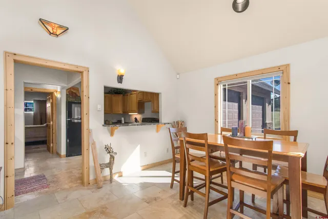 a bathroom with a granite countertop sink mirror vanity and toilet